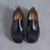 Mocasines Yukoner Penny de cuero negro para hombre Mocasines Yukoner Penny de cuero negro para hombre