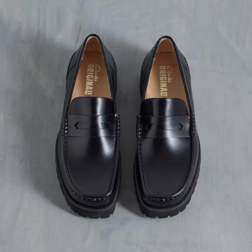 Mocasines Yukoner Penny de cuero negro para hombre Mocasines Yukoner Penny de cuero negro para hombre