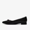Zapatillas slip-on Natalyn Trim de piel negra para mujer Zapatillas slip-on Natalyn Trim de piel negra para mujer